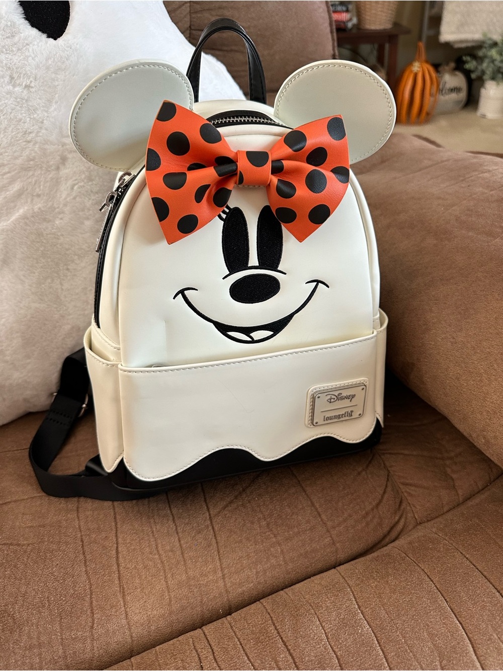 Loungefly Cream Minnie Backpack with Orange Polka Dot Bow Glow in the Dark.